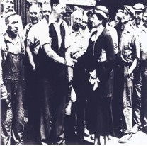 - Secretary of Labor Frances Perkins shakes hands with Carnegie Steel Workers during a tour of Homestead, Pennsylvania, July 1933. 